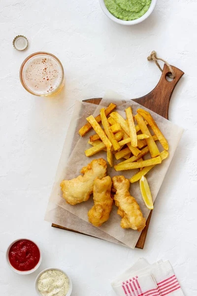 Fish and chips on a white background. British fast food. Recipes. Snack to beer. Traditional british food.