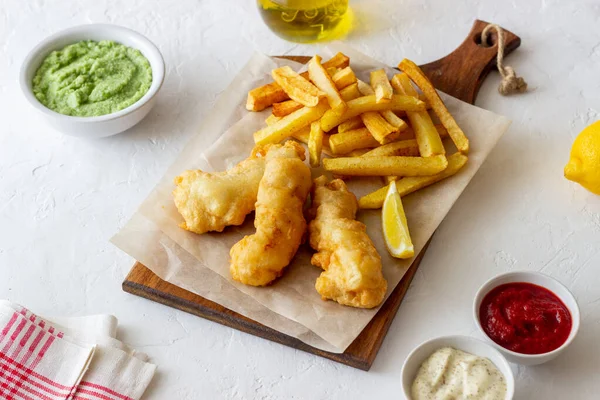 Fish and chips on a white background. British fast food. Recipes. Snack to beer. Traditional british food.