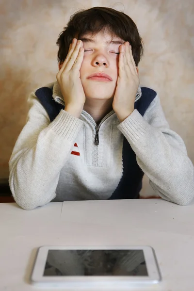  boy with headache and tired eyes 