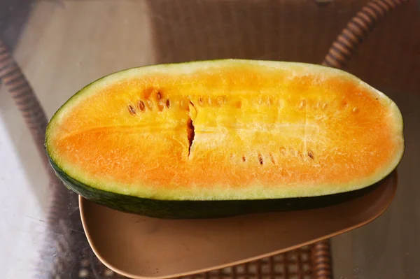 Yellow water melon cut on the plate — Stock Photo, Image