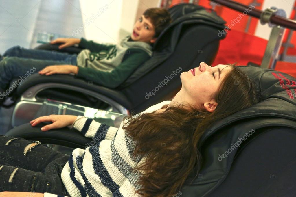Teen Siblings Brother And Sister In Massage Chair Stock Photo Teen Siblings Brother And Sister In Massage Chair Stock Photo