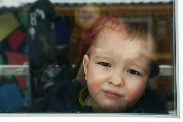 Cute toddler baby boy close up portrait with flat nose agains the window — Stock Photo, Image