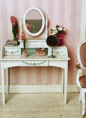 Cozy stylish vintage corner of the pink bedroom with floor vase clipart