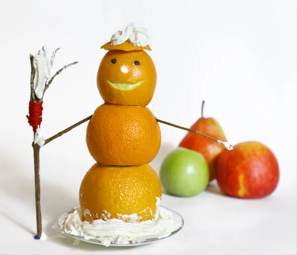 Snowman from orange with broom — Stock Photo, Image