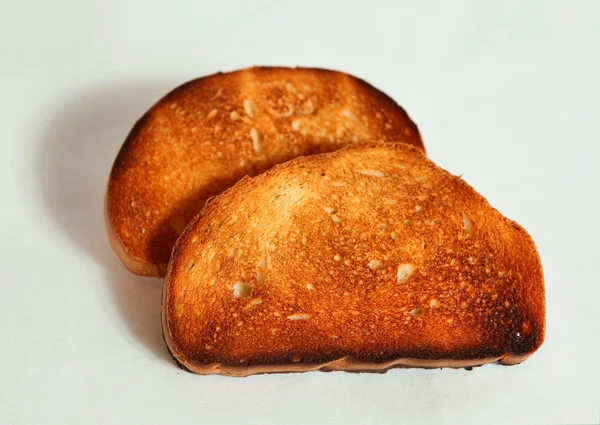 Toast, bread slice burned, overexposed in toaster — Stock Photo, Image