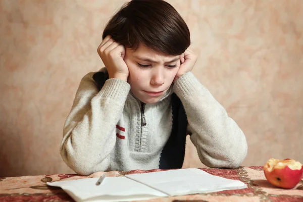 Little preteen boy do his homework has difficulties — Stock Photo, Image