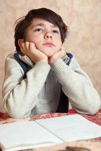 Little preteen boy do his homework has difficulties — Stock Photo, Image