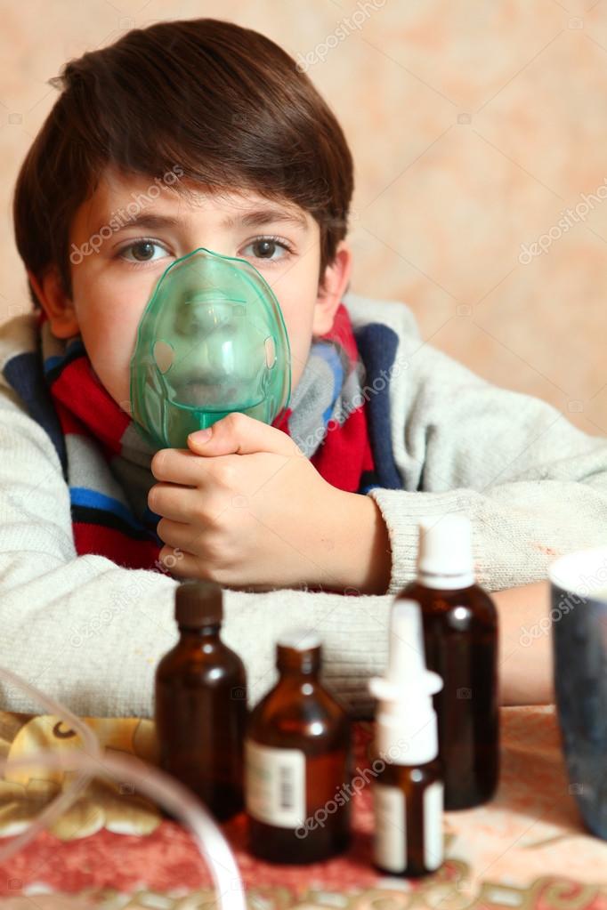 Boy with electric inhaler as a curation against virul disease flue