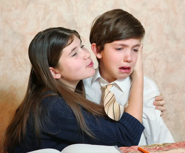 Daughter comfort crying son — Stock Photo, Image