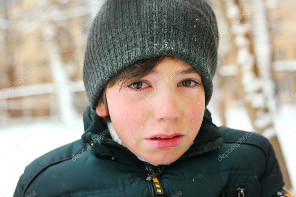 preteen boy cry frustrated after tearing his jacket