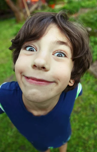 Handsome preteen boy expressive foreshortening portrait — Stock Photo, Image