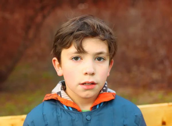 Preteen handsome boy close up portrait in the spring park — Stock Photo, Image