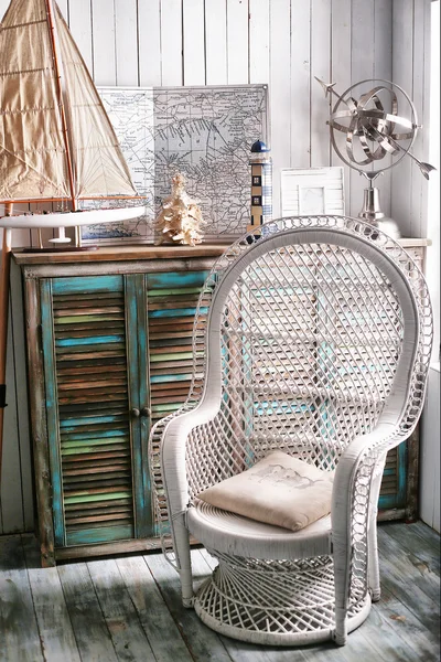 Sea travel styled shabby chic interior corner with map wicker ch — Stock Photo, Image