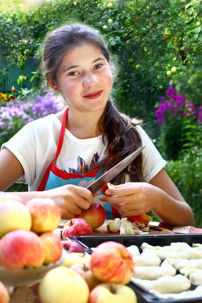 Girl cook apple croissants with own apples from garden — Stock Photo, Image