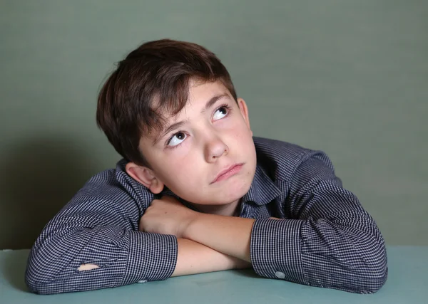 Preteen schoolboy close up thinking portrait — Stock Photo, Image