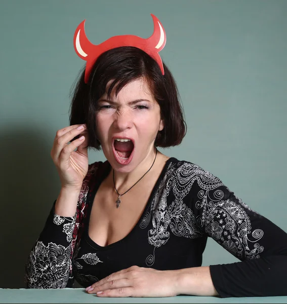 Woman with halloween red horns — Stock Photo, Image