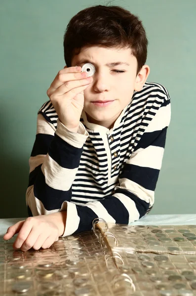 Boy preteen numismatic collector show his coin — Stock Photo, Image