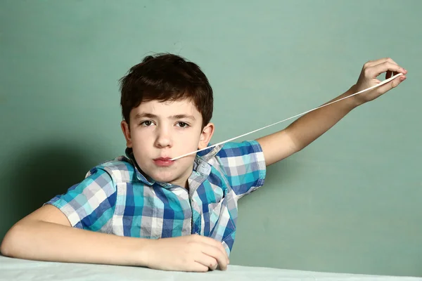 Boy pull chewing gum with his hand from moth — Stock Photo, Image