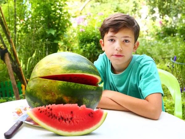 Preteen handsome boy with water melon — Stock Photo, Image