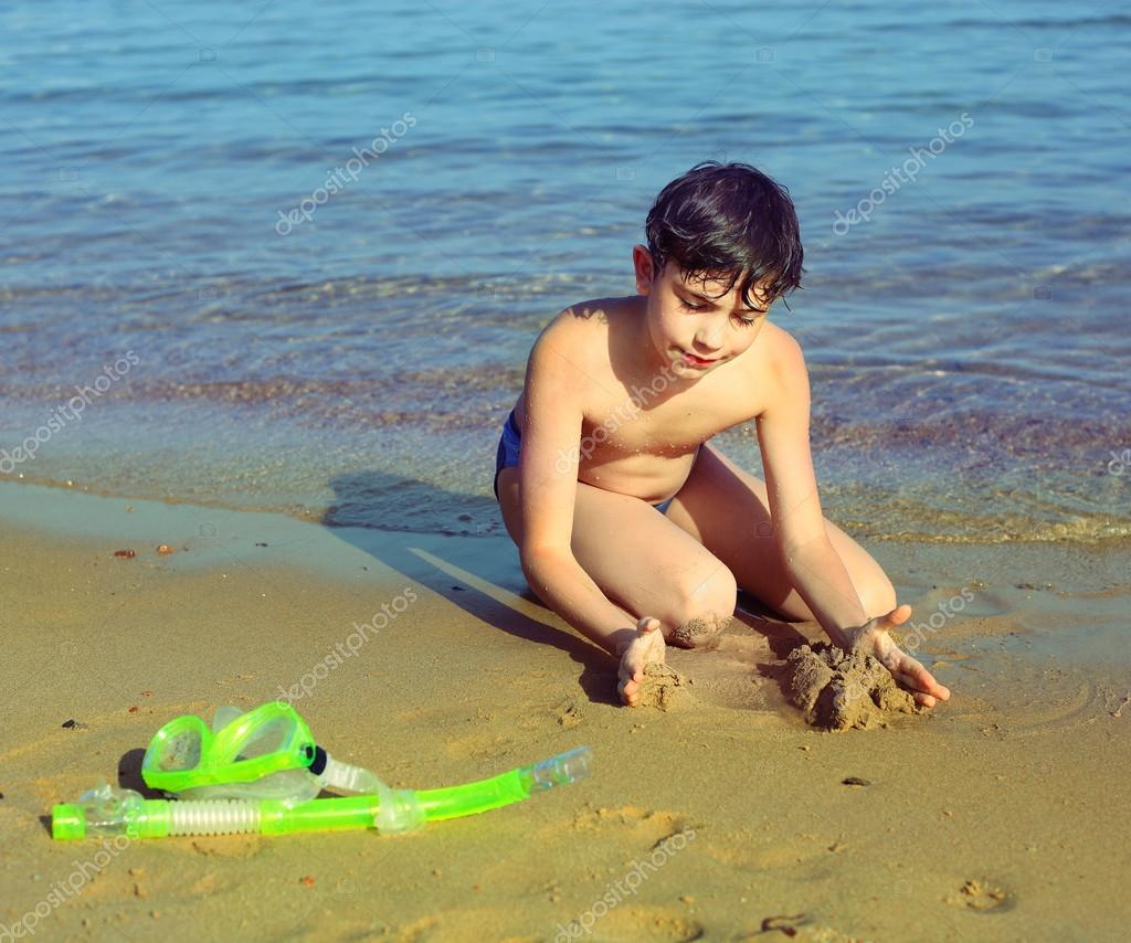 Boy On The Beach Take Sun Bathing Play With Sand Stock Photo Image By C Ulianna Boy On The Beach Take Sun Bathing Play With Sand Stock Photo Image By C Ulianna