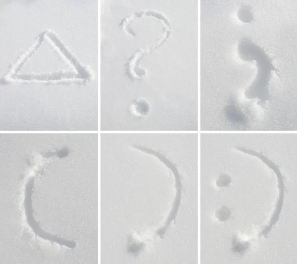 The symbols and geometric figures painted on the snow — Stock Photo, Image