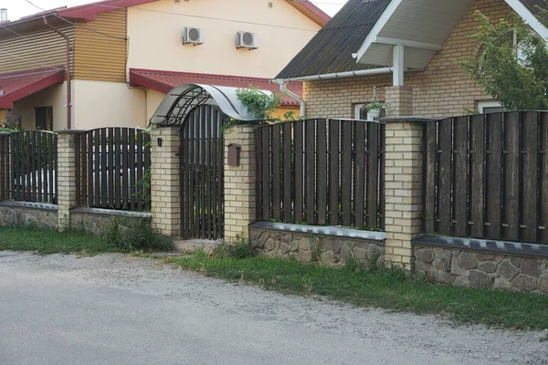 Brown Fence Wall Closed Door Made Wooden Boards Bricks Stone — Stock Photo, Image