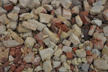 Sokaktaki eski kahverengi gri tuğla parçalarının taş dokusu.