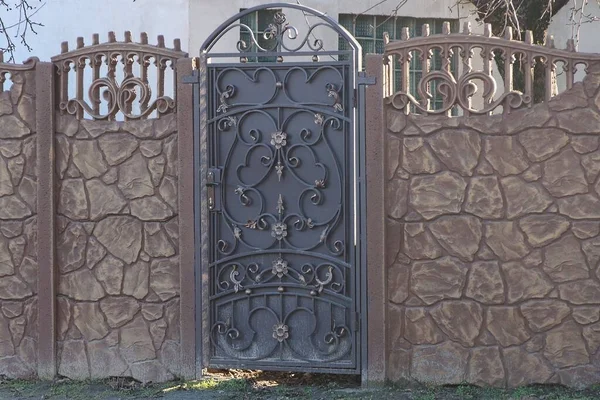 One Brown Metal Closed Door Black Forged Pattern Part Stone — Stock Photo, Image