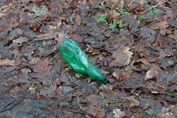 Garbage One Old Green Plastic Dirty Bottle Lies Brown Leaves — Zdjęcie stockowe