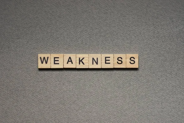 Text Word Weakness Brown Wooden Small Letters Black Font Gray — Stock Photo, Image
