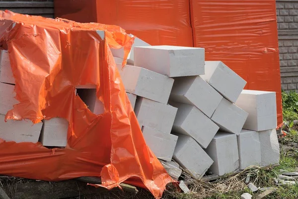 Pile White Bricks Foam Blocks Red Plastic Cellophane Packaging Street — Stock Photo, Image