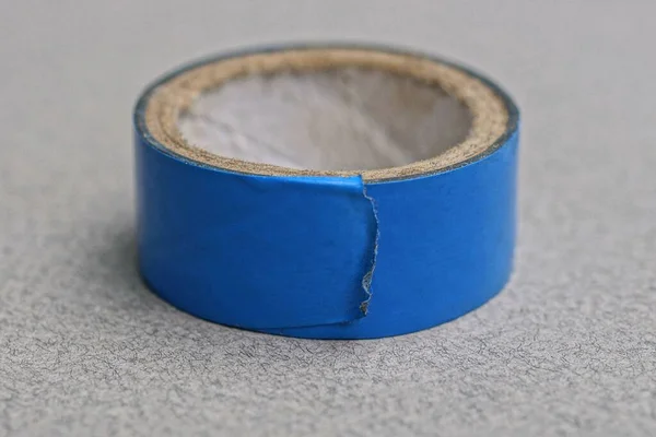 One Skein Blue Plastic Tape Lies Gray Table — Stock Photo, Image