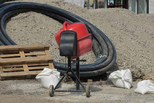 One Red Concrete Mixer Stands Street Construction Site White Bags — Stock Photo, Image