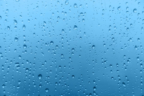 Lluvia sobre vidrio, textura de fondo — Foto de Stock