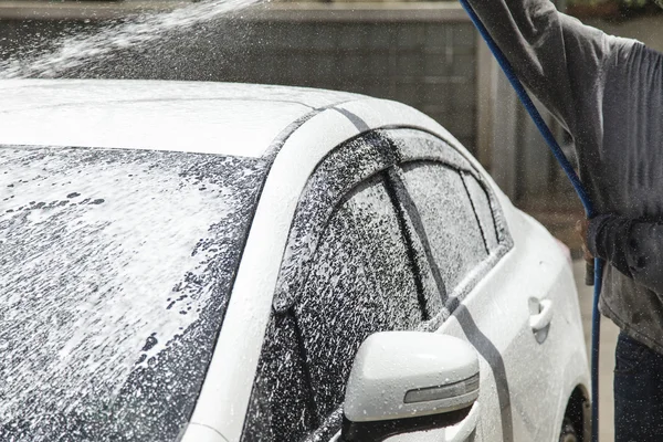 Washing a car at car wash service — Stock Photo, Image