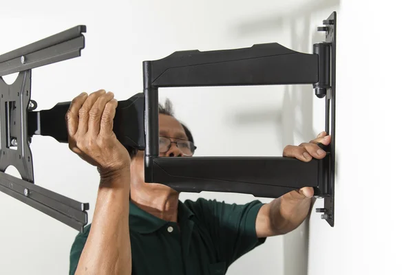 Man installing mount TV — Stock Photo, Image