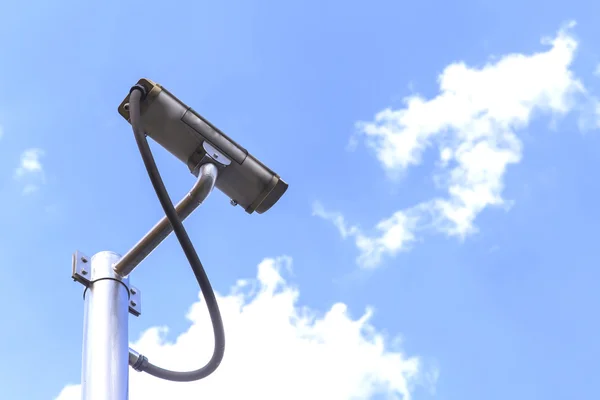 Security camera on blue sky background — Stock Photo, Image