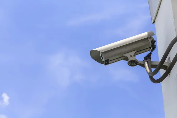 Security camera on blue sky background — Stock Photo, Image