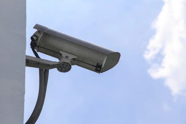 Security camera on blue sky background Royalty Free Stock Images