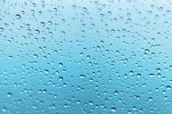 Gotas de chuva no fundo de vidro — Fotografia de Stock