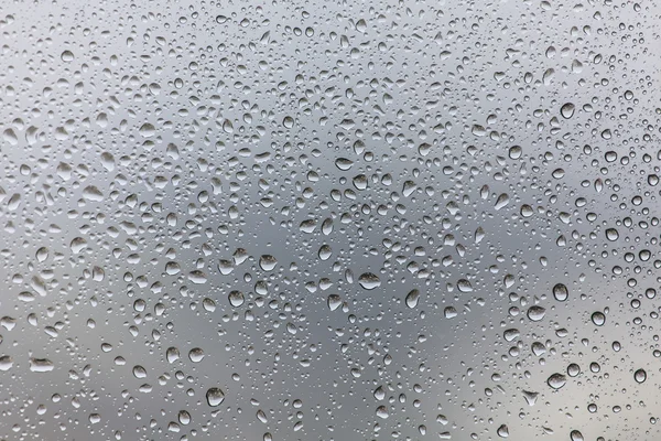 Gocce di pioggia su fondo di vetro — Foto Stock