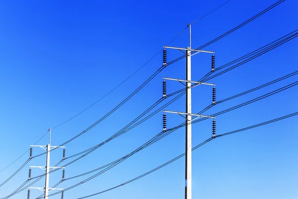 Electric pole on blue sky — Stock Photo, Image