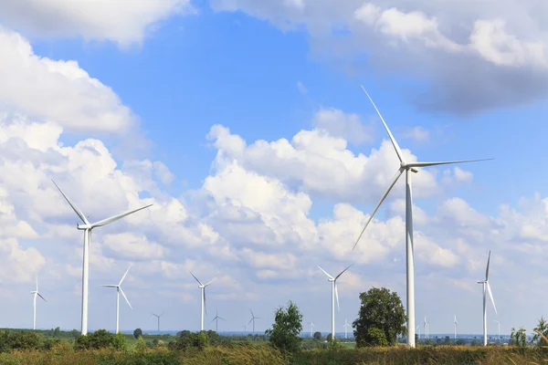 Wind turbine renewable energy source summer landscape with blue sky — Stock Photo, Image
