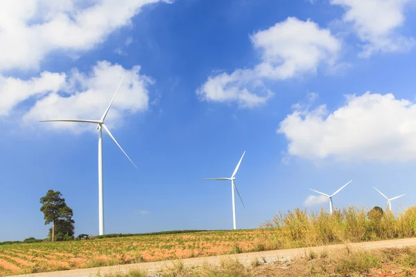 Wind turbine renewable energy source summer landscape with blue sky — Stock Photo, Image