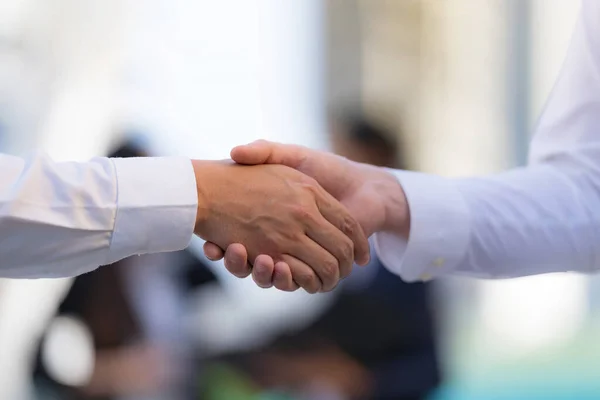 Close Handshake Two Businessmen Background Modern Office Partnership Concept Shaking — Stock Photo, Image