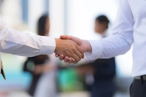 Close Handshake Two Businessmen Background Modern Office Partnership Concept Shaking — Stock Photo, Image