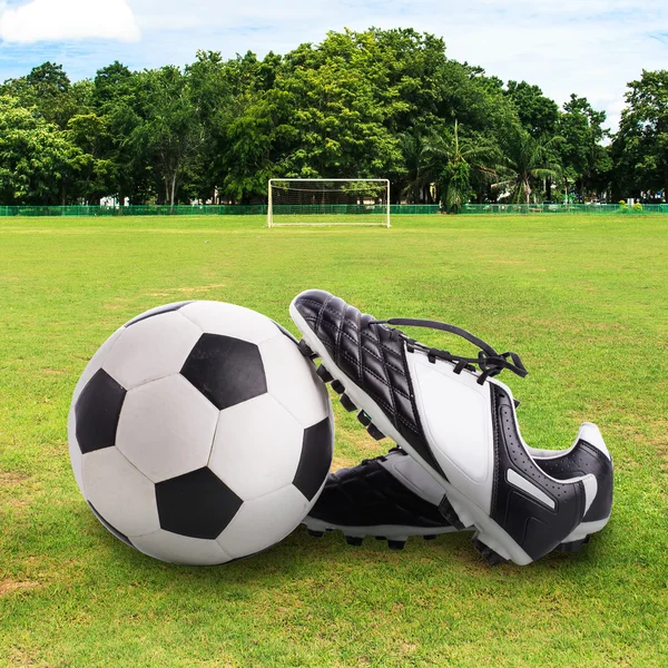 Soccer ball and soccer shoes Royalty Free Stock Photos