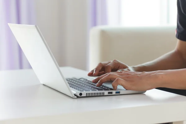 Hands typing on laptop keyboard — Stock Photo, Image