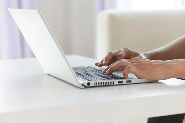 Hands typing on laptop keyboard — Stock Photo, Image