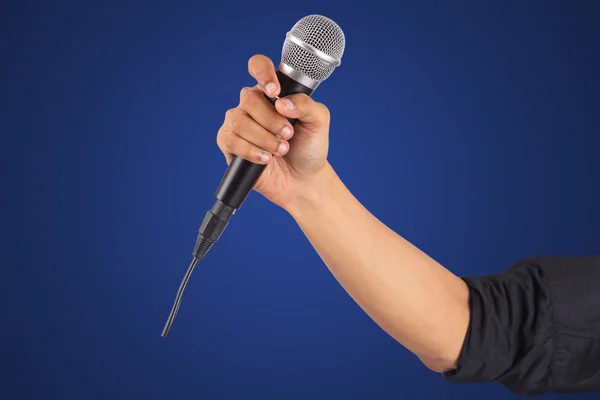 Male hand holding microphone — Stock Photo, Image